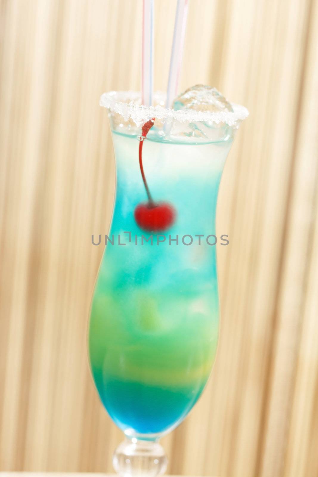 blue cocktail with cherry by shebeko