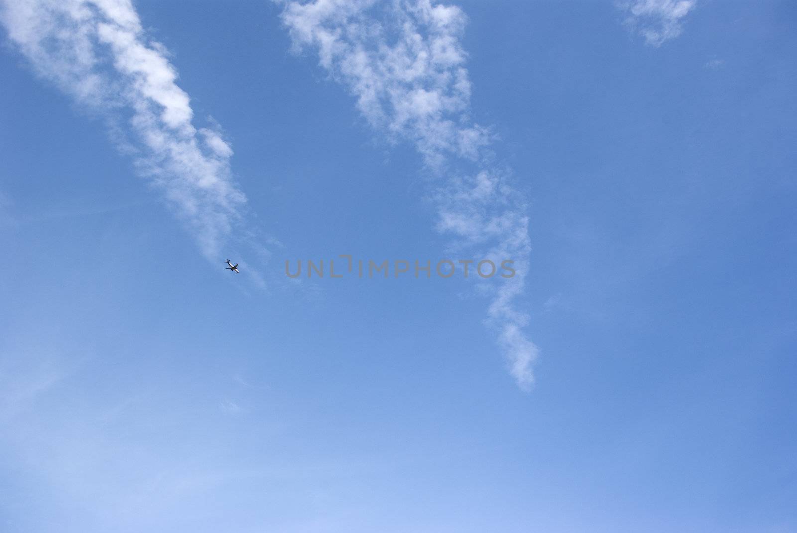 airliner airplane flying above the clouds