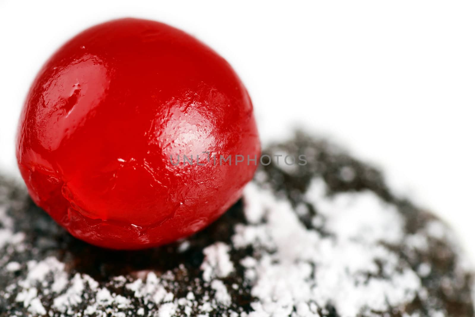Maraschino cherry on chocolate cake by Mirage3