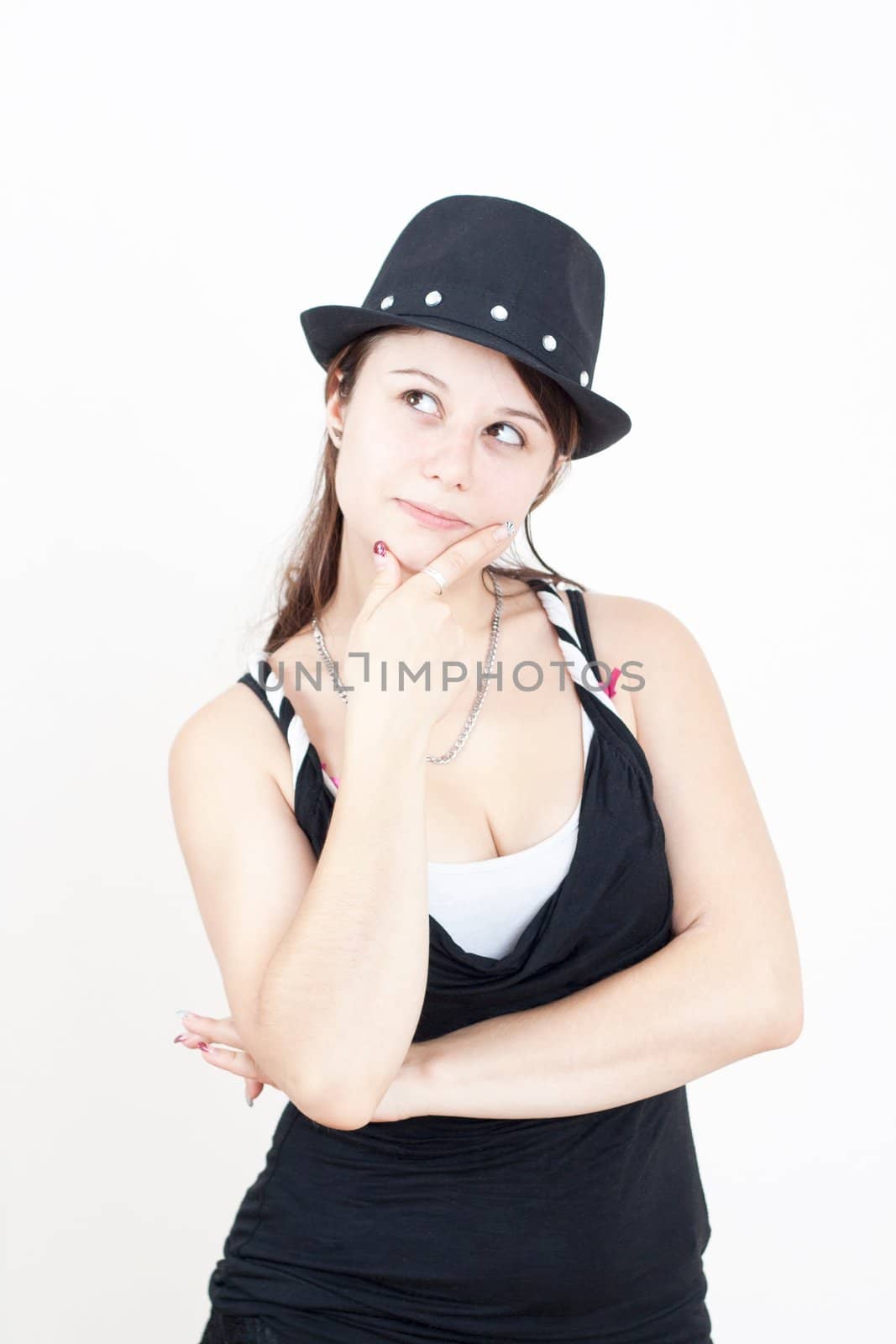 young brunette girl with black hat wearing is thinking about somethink