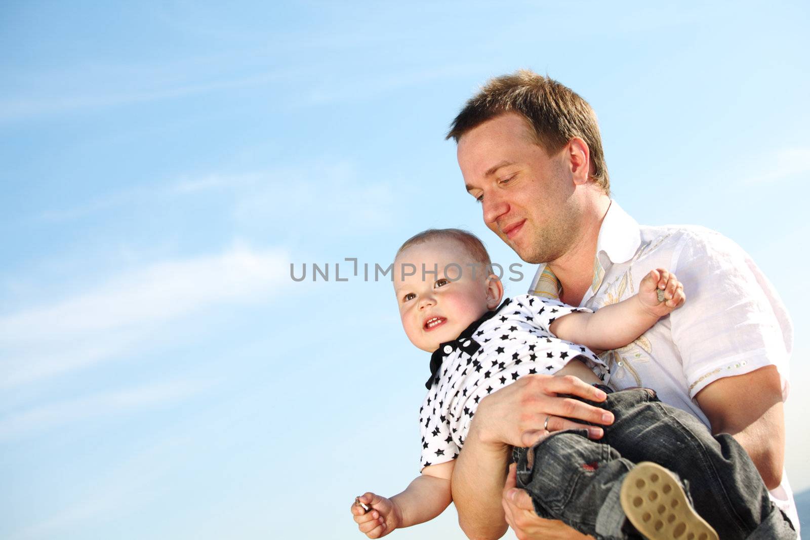 father and son in blue sky