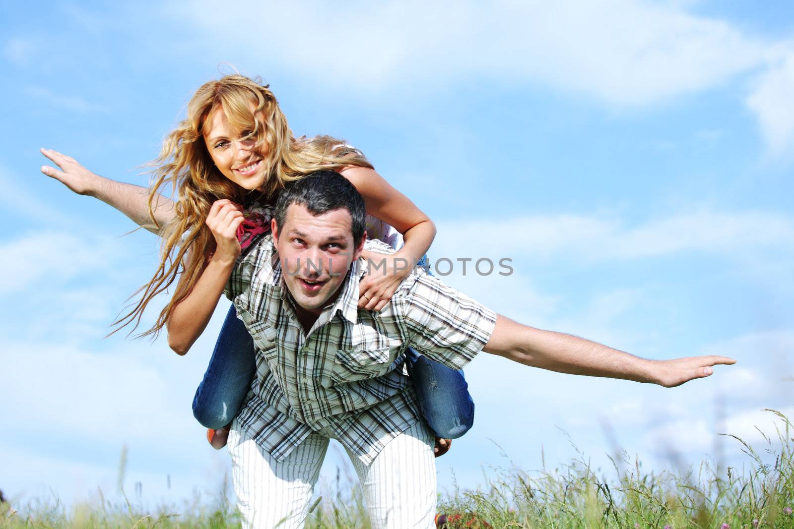 man and woman hug in the sky