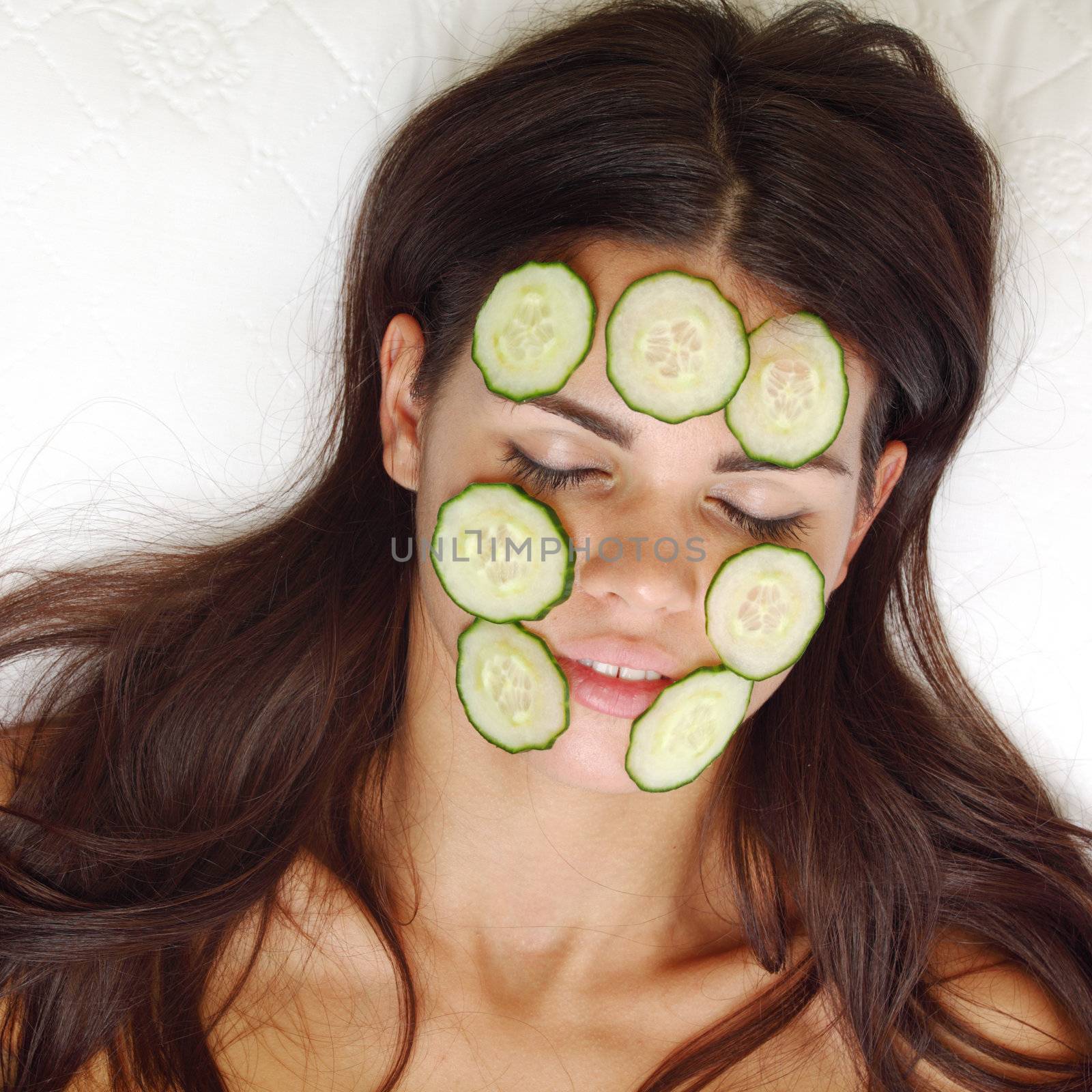 cucumbers circles on a girl face