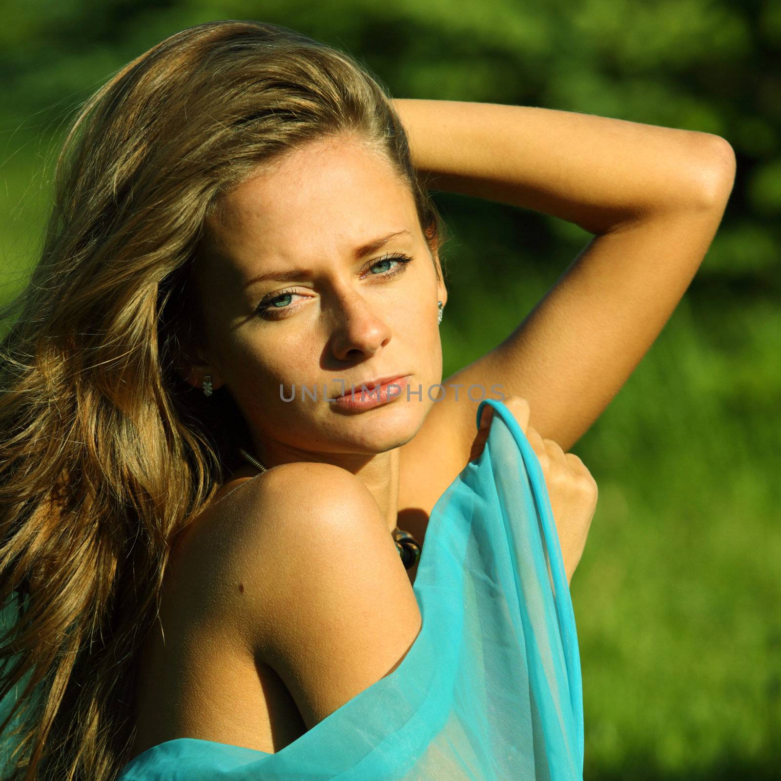 woman on the green grass happy and smile