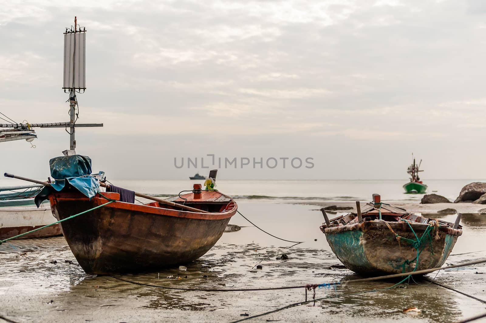 Two old boat on beach in overcast sky day evenning time