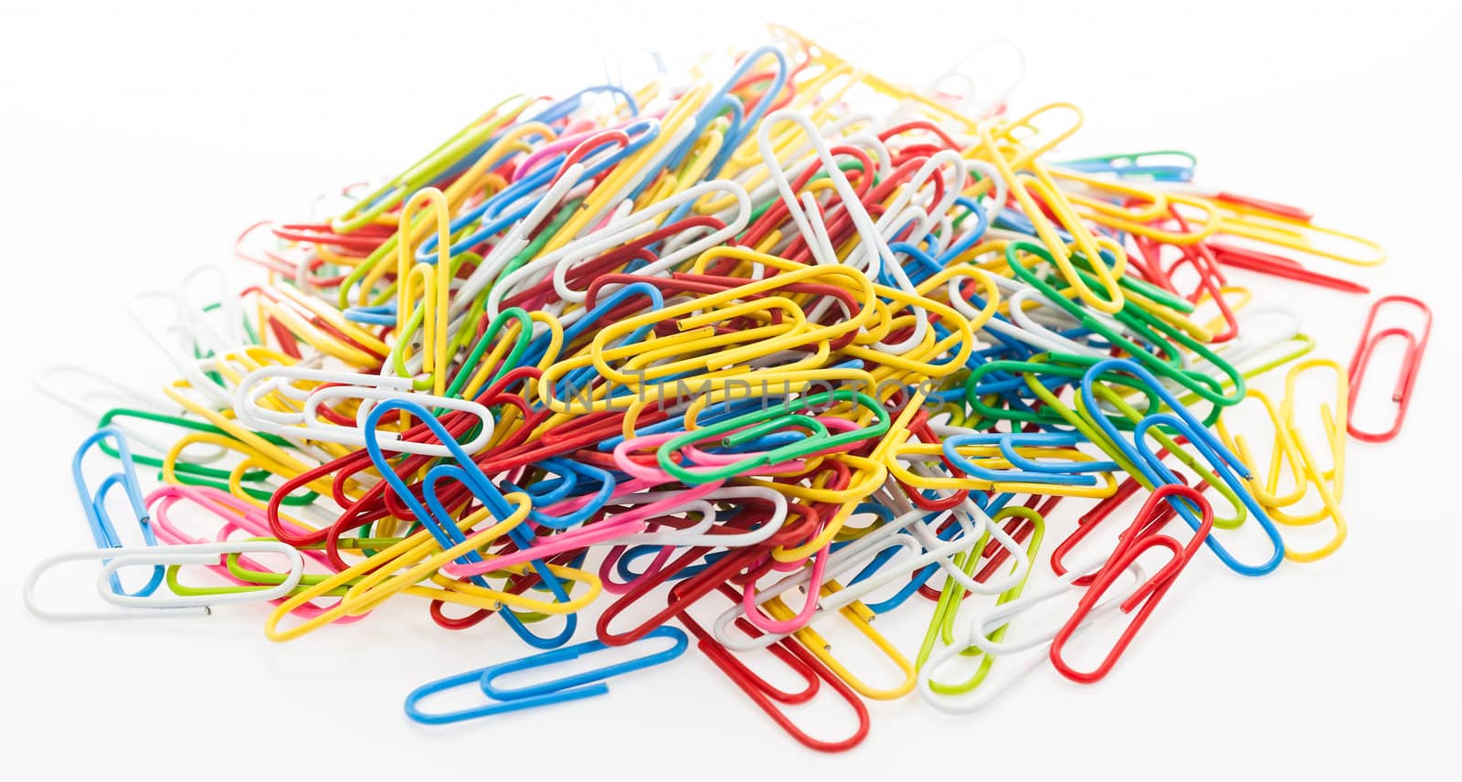 Colorful paper clip on white background by moggara12