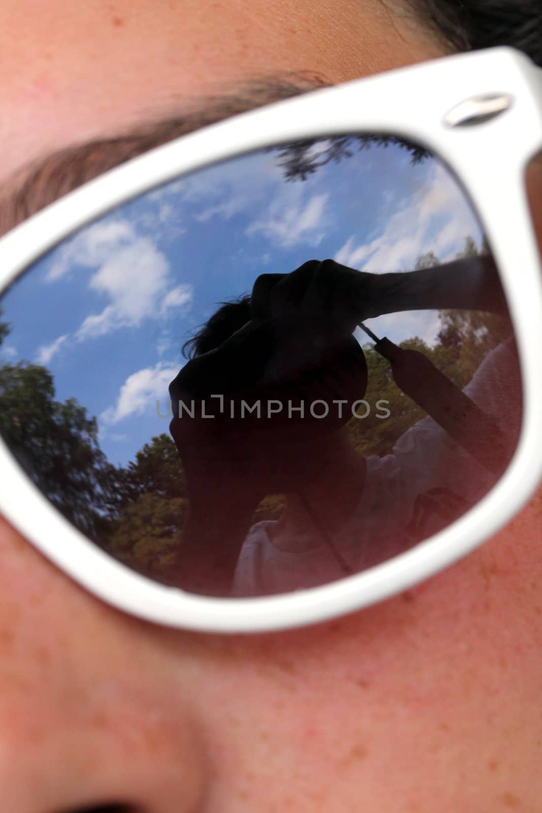 young woman with sunglasses close up