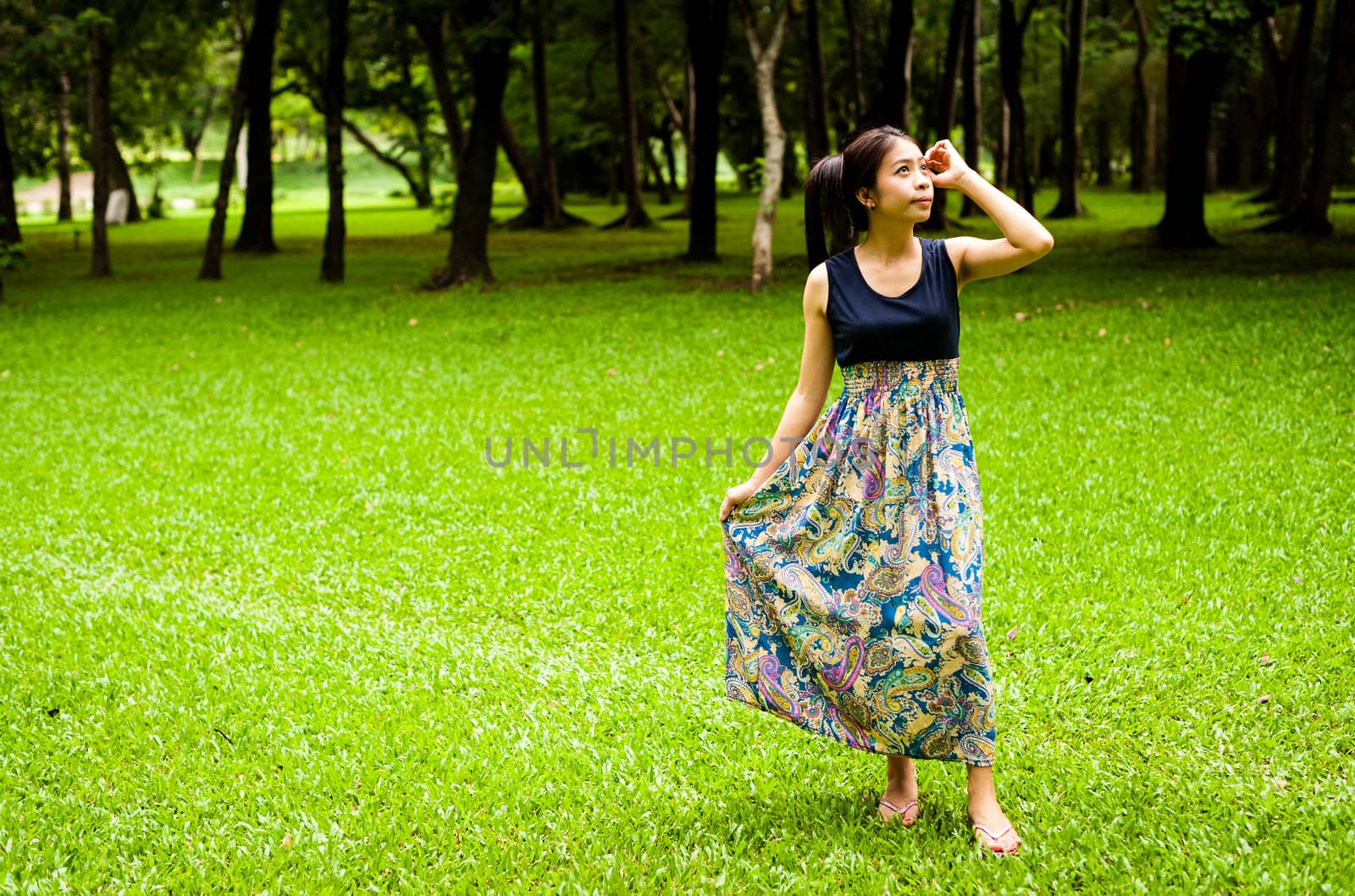 Portrait woman asian girl with tree background  in the garden