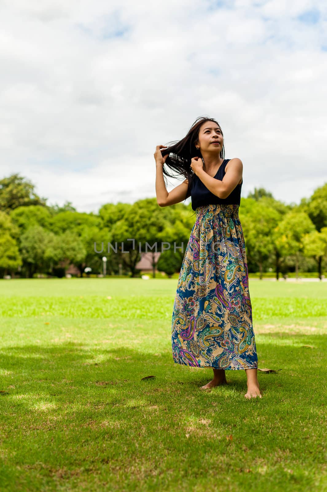 Portrait woman asian girl with tree background  in the garden