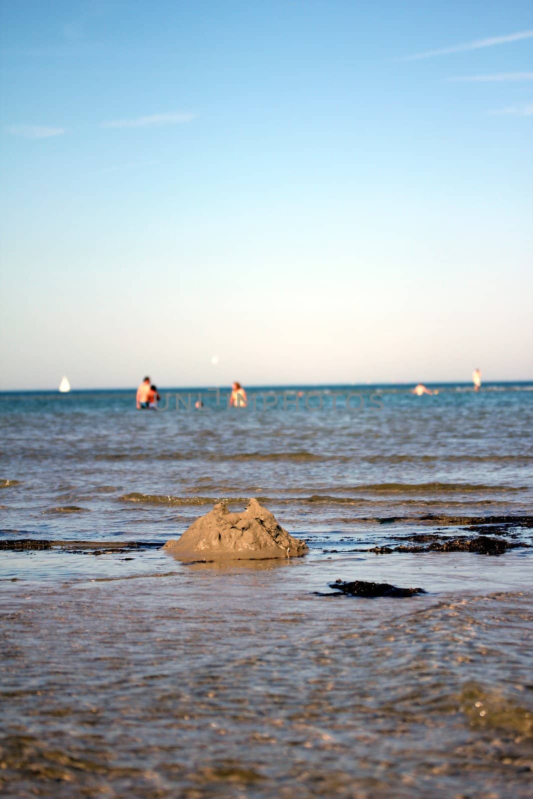 broken sandcastle at the beach