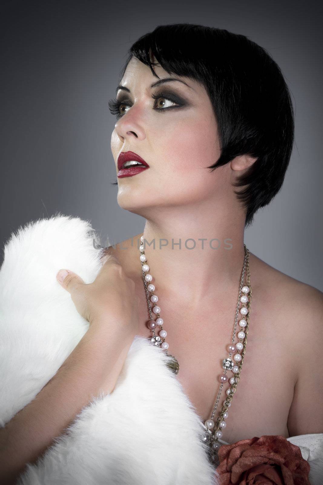 sensuous short haired brunette woman, bare shoulders with white fur, flirty, beautiful, sweet, 20s flapper hollywood style