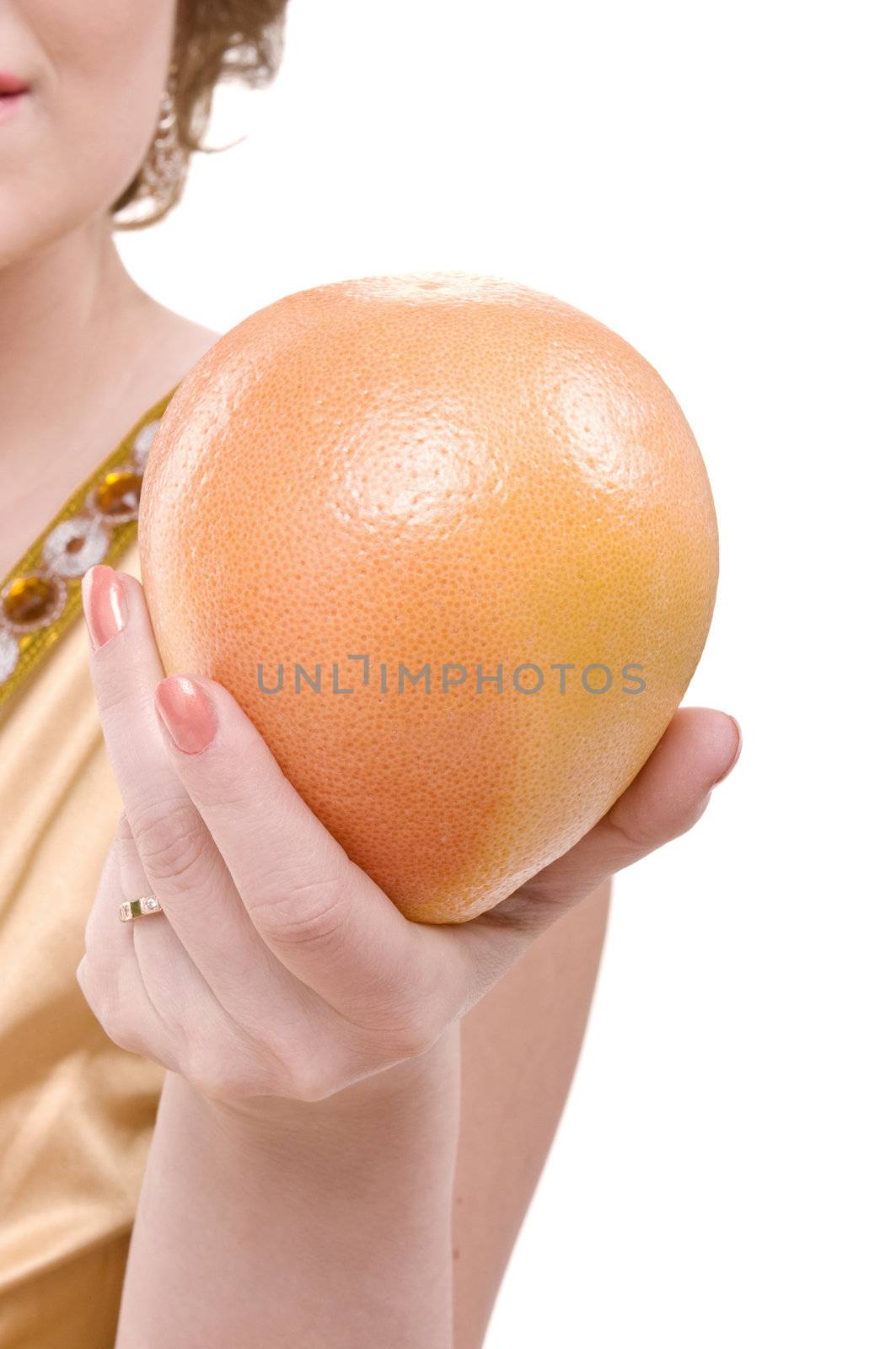 Fresh grapefruit in beauty female hand isolated on white background