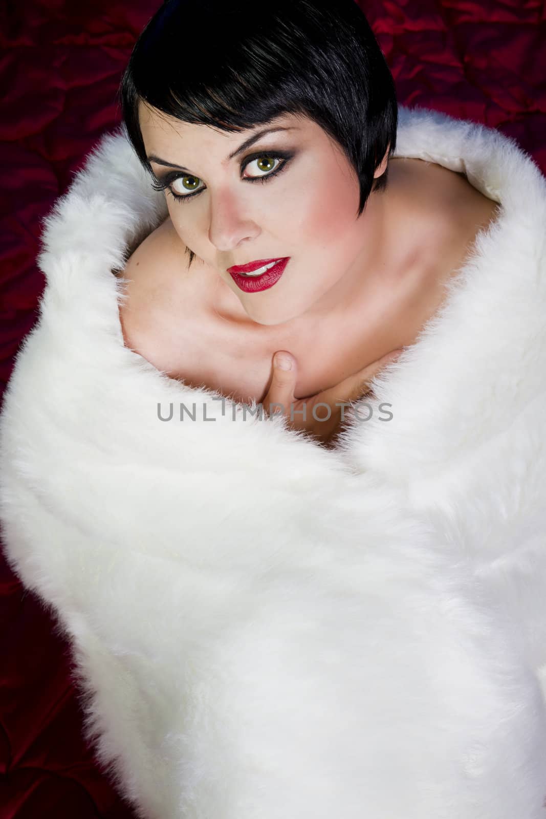 sensuous short haired brunette woman, bare shoulders with heart shaped white fur, 20s old hollywood star style