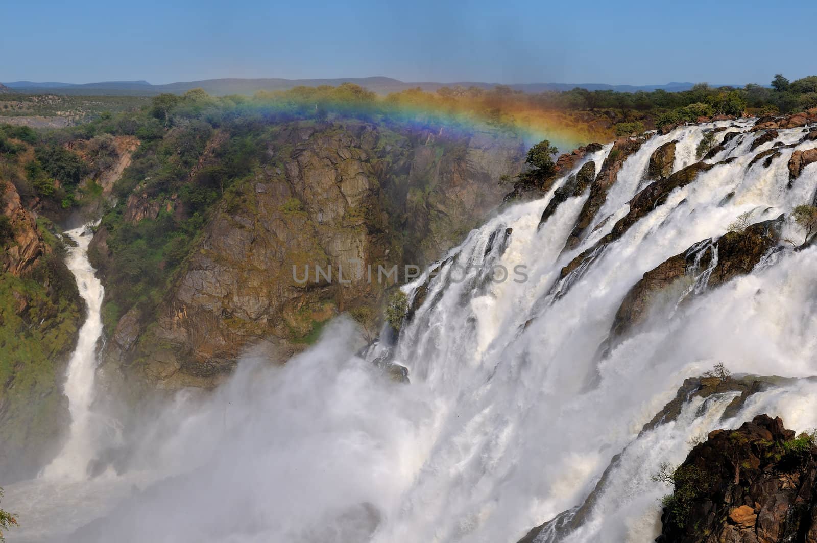 Rainbow over the Ruacana waterfalls on the boder between Angola and Namibia 