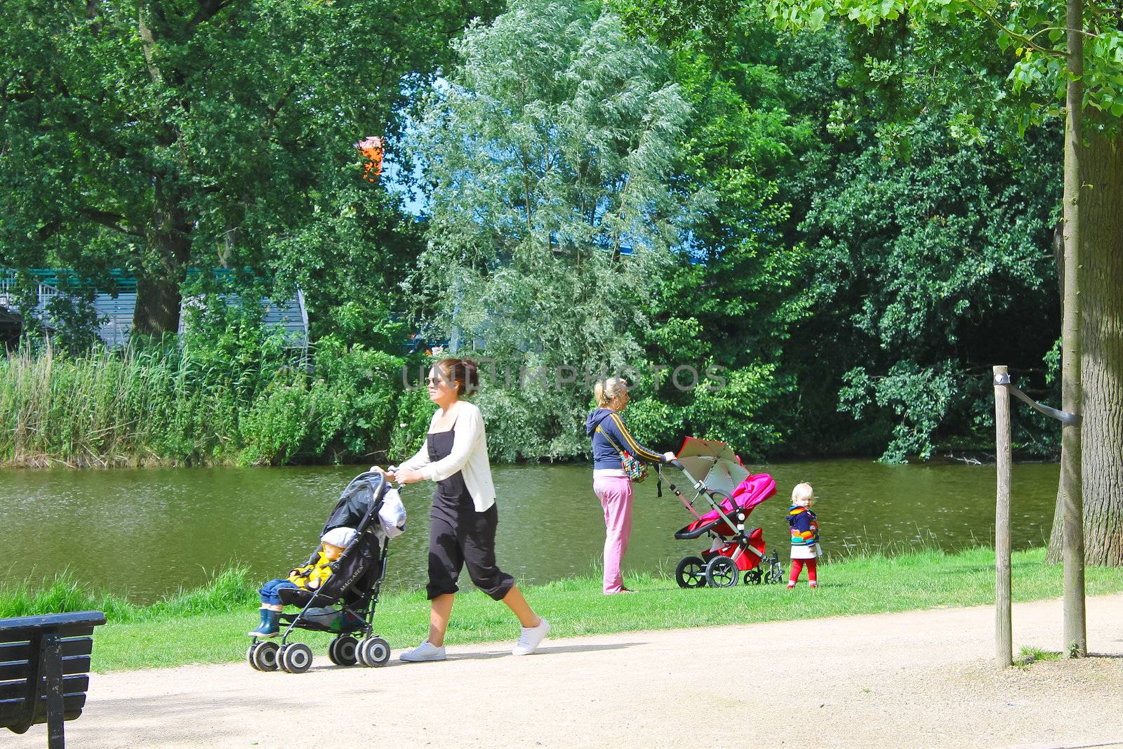 Mothers with children in city park in Amsterdam. Netherlands