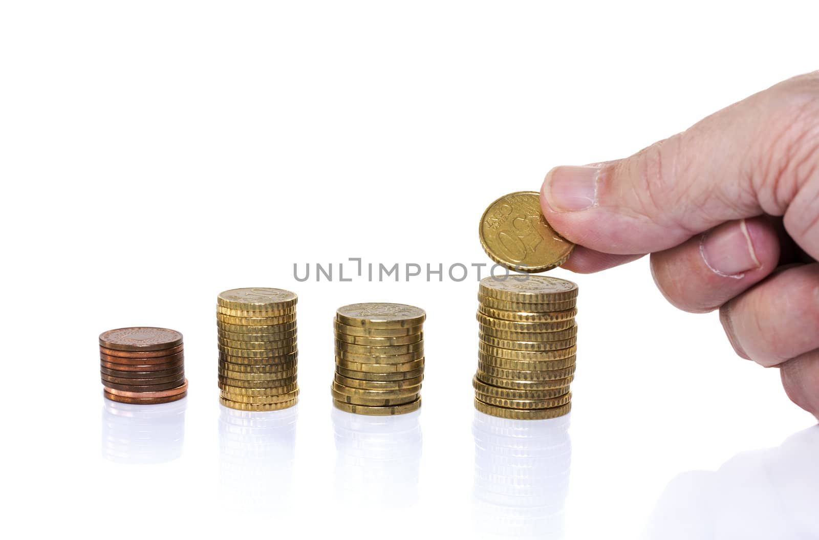 man putting euro coin on stack money