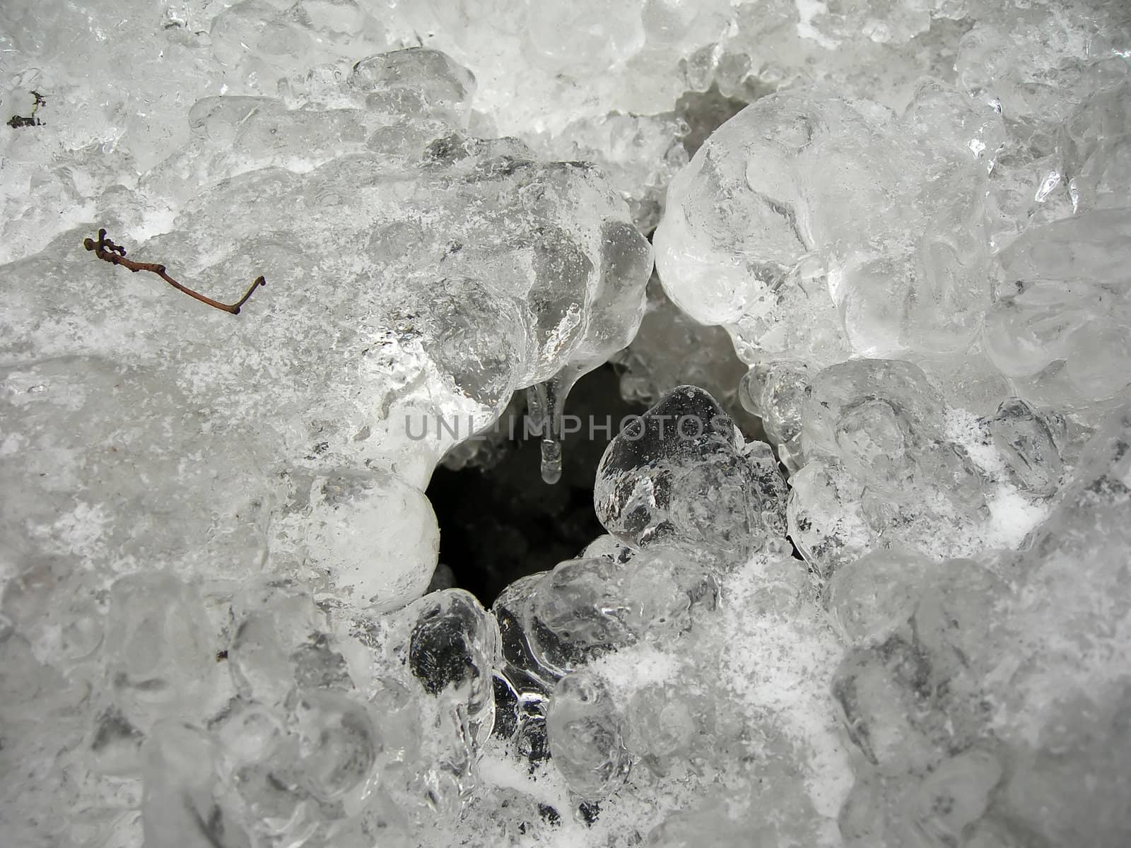              Brook is covered by ice and water flows under them with a small strem          