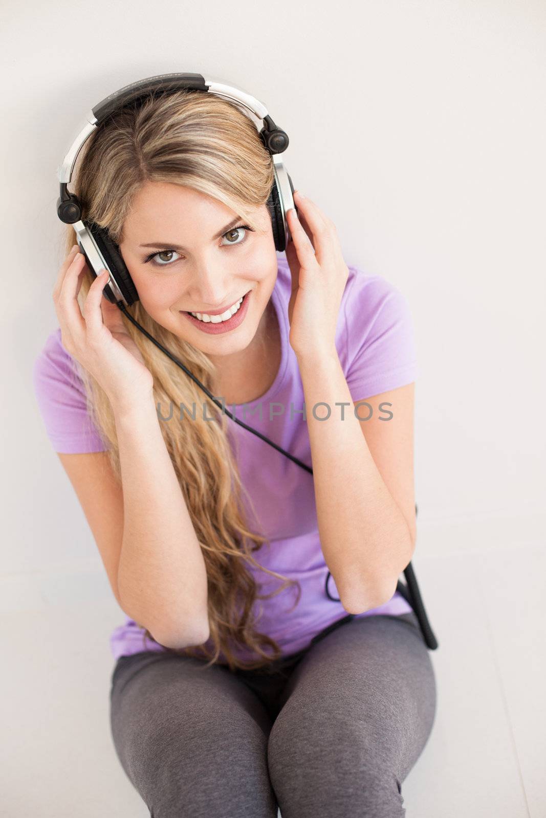 young beautiful woman listen music with headphones by Lcrespi