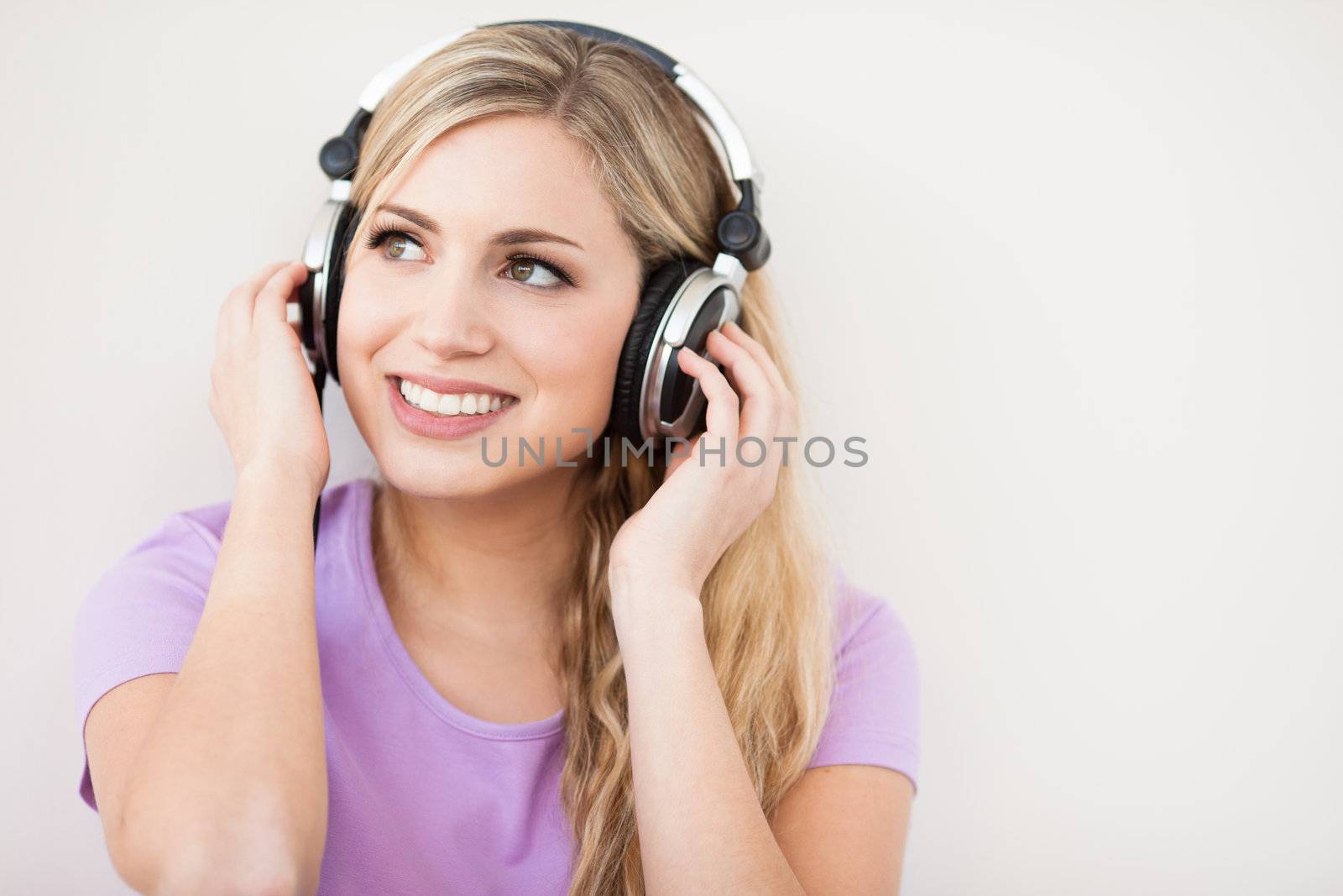 young beautiful woman listen music with headphones by Lcrespi