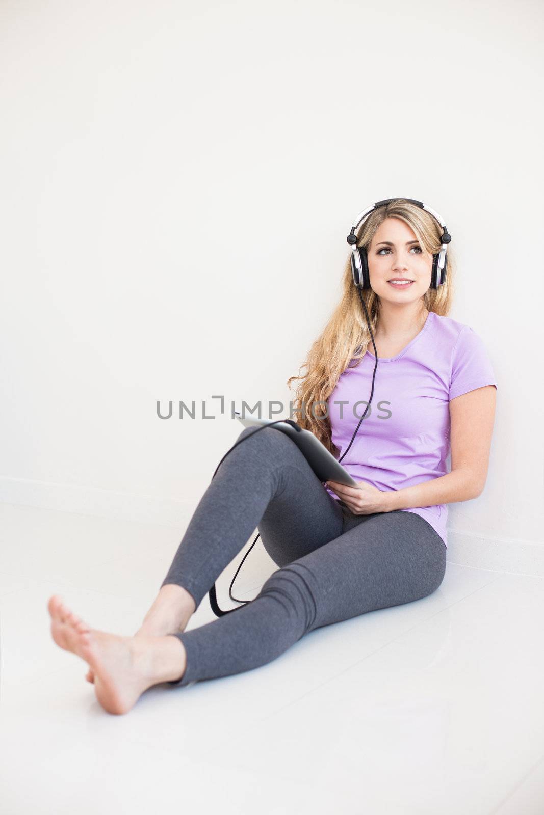 young beautiful woman listen music with headphones isolated