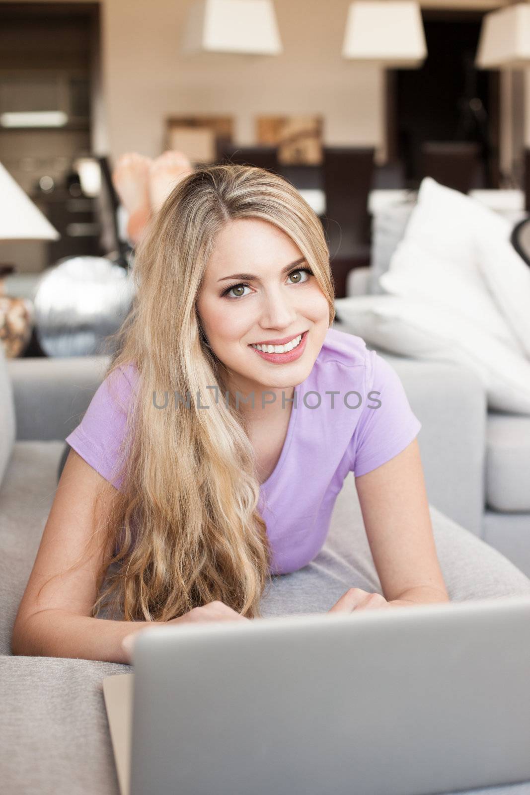 young beautiful woman using a laptop computer at home