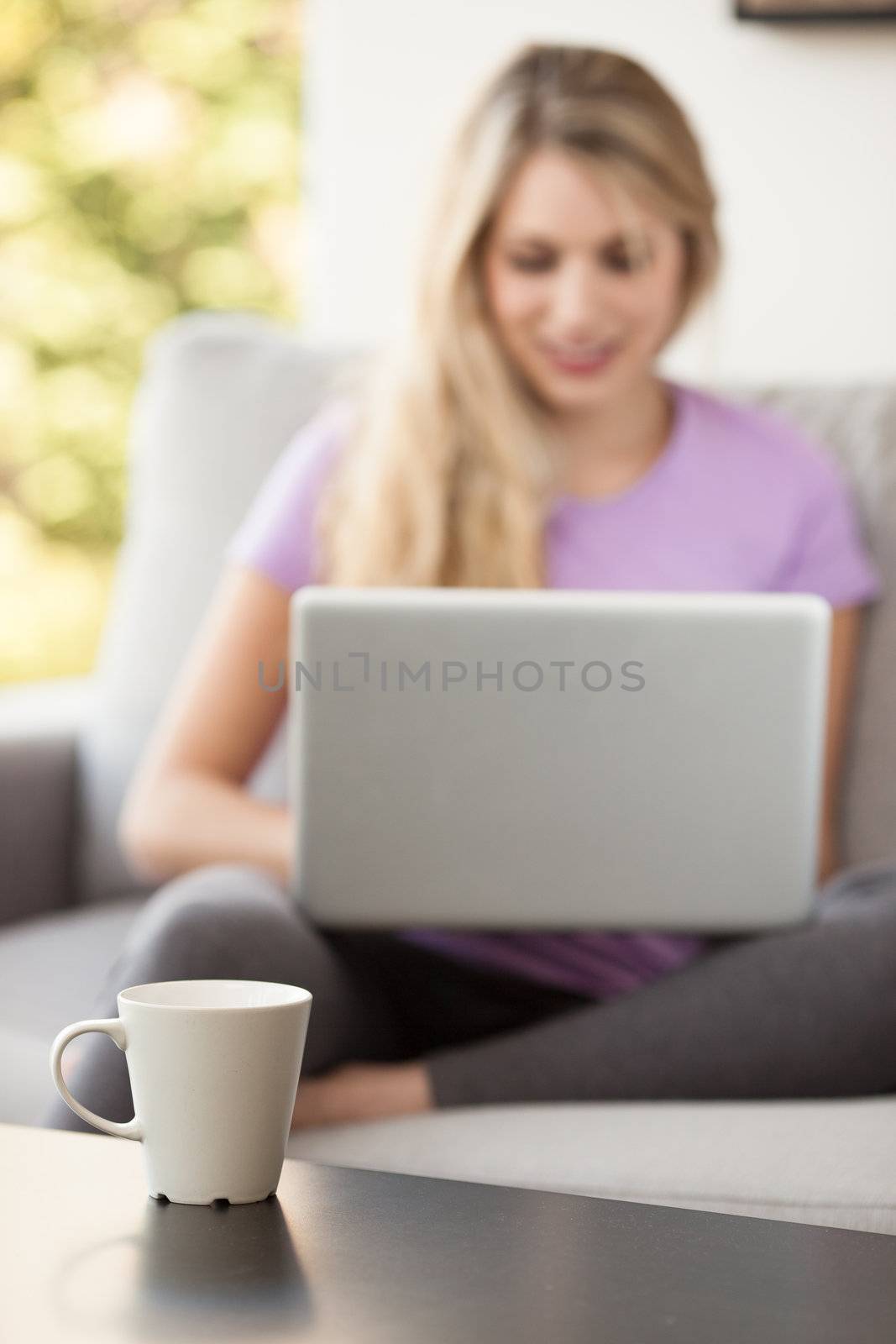 young beautiful woman using a laptop computer at home