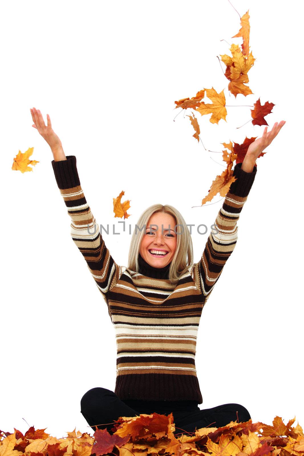  woman drop up autumn leaves in studio