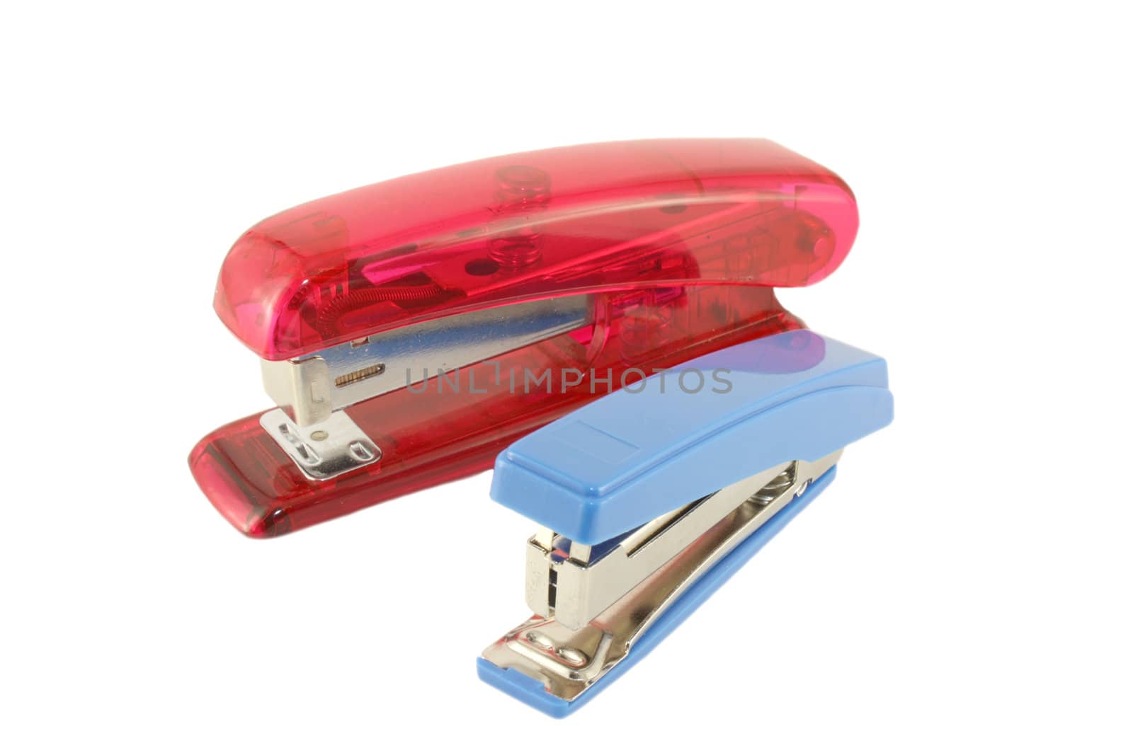 Blue and red staplers over white