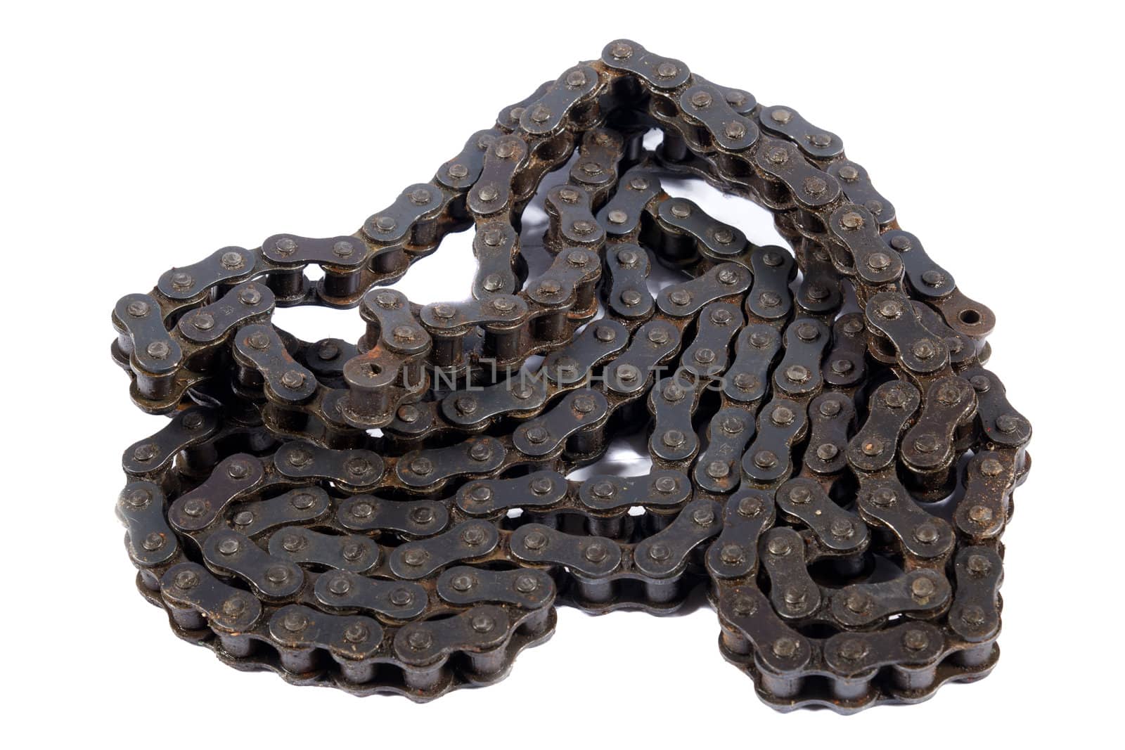 close up of oily motorcycle chain on a white background