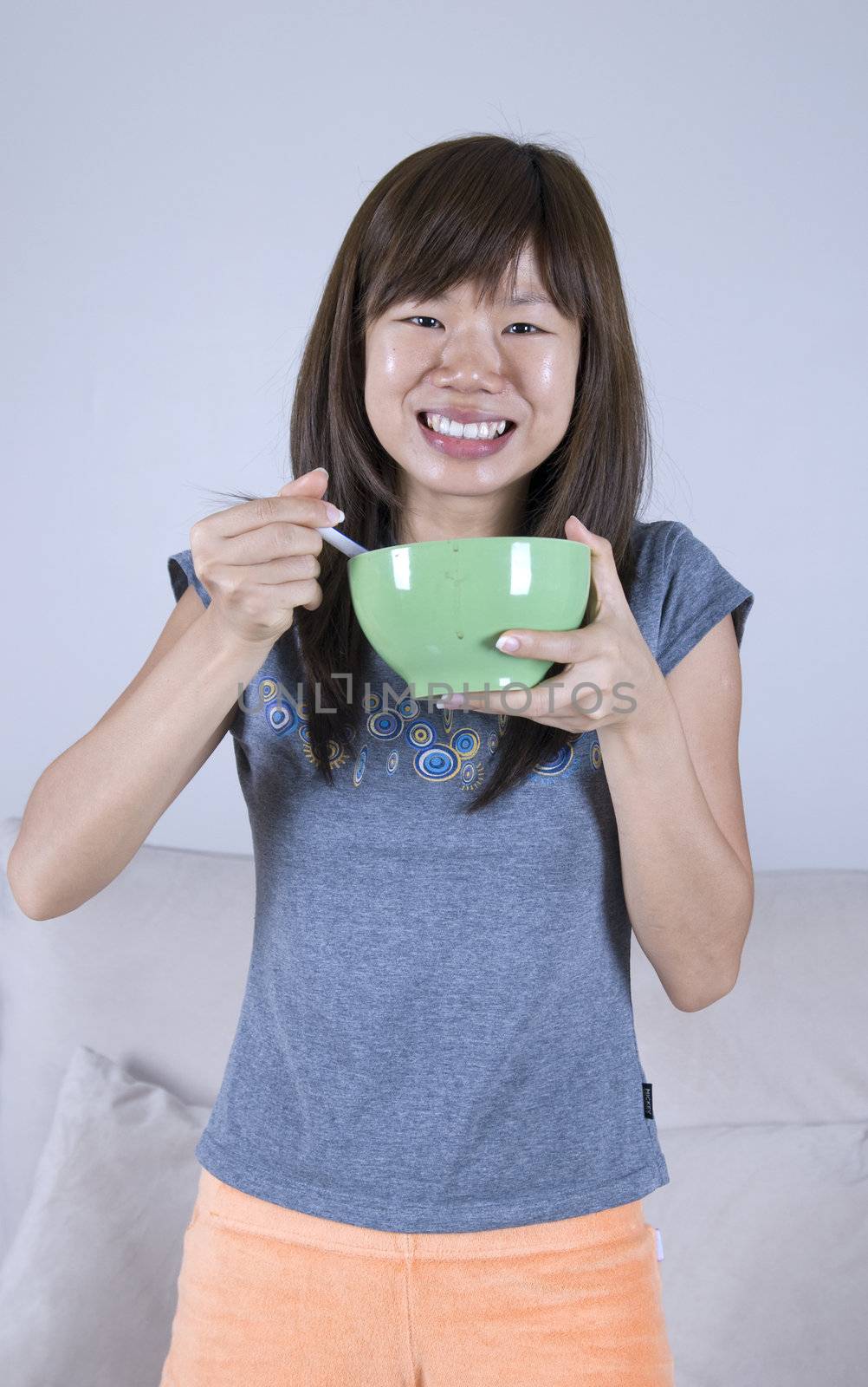 asian tua pui girl eating and smiling