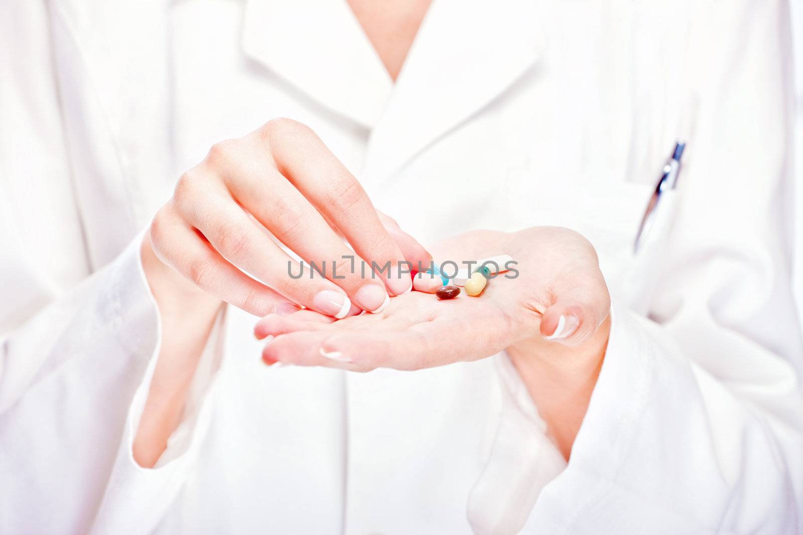Pills in doctor's hands by imarin