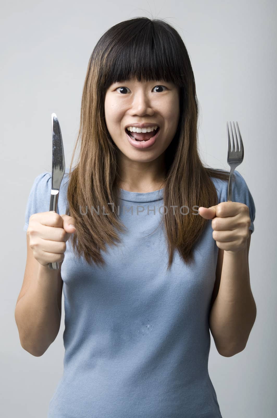 asian women on diet with fork and knife