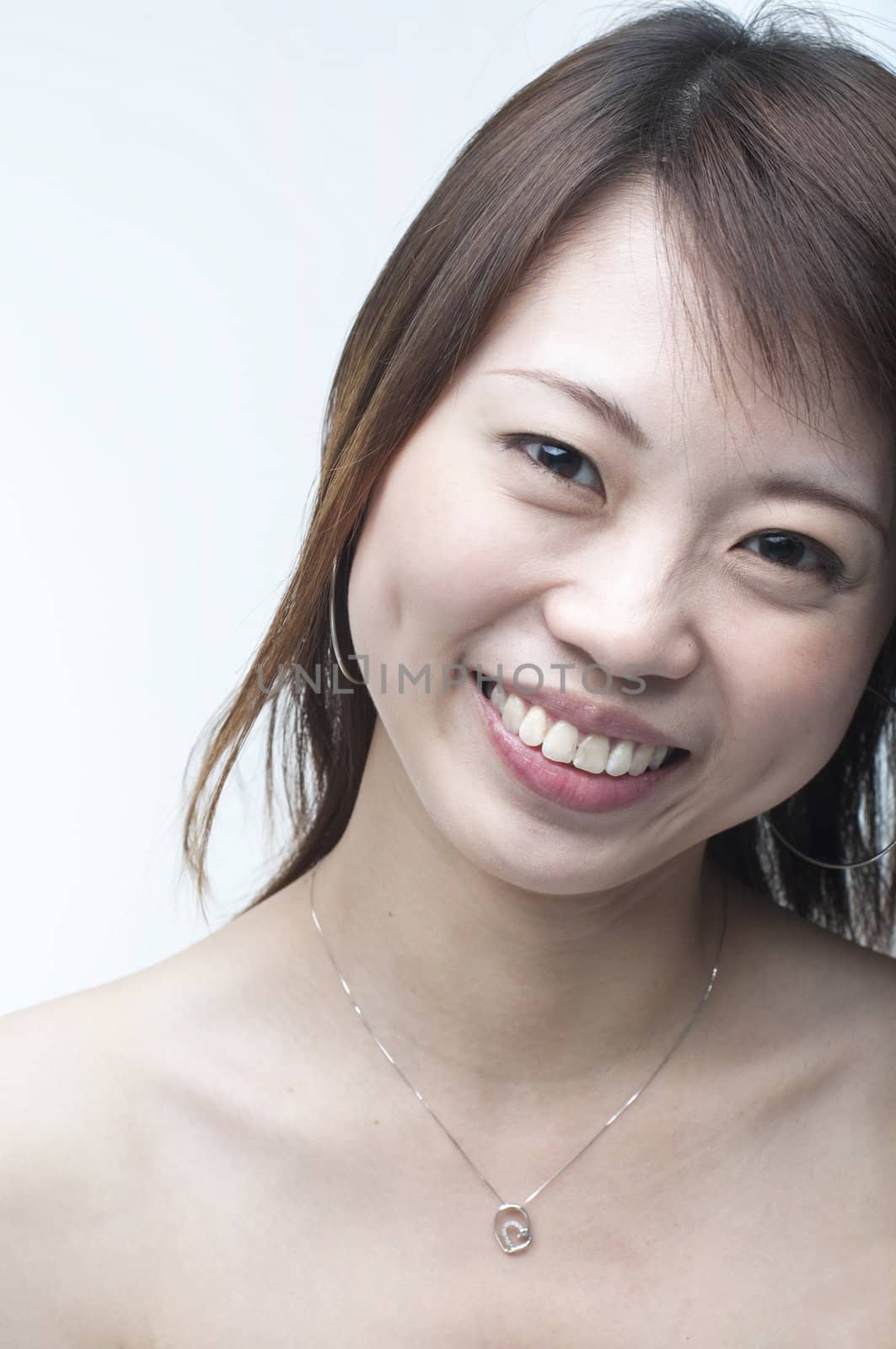  close portrait shot of smiling asian girl