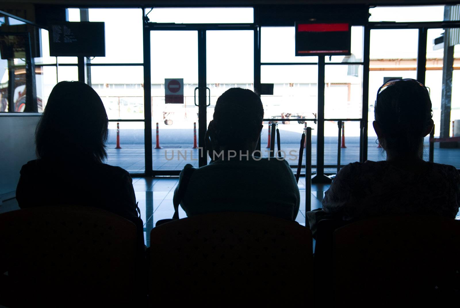 silhouette of airport passengers