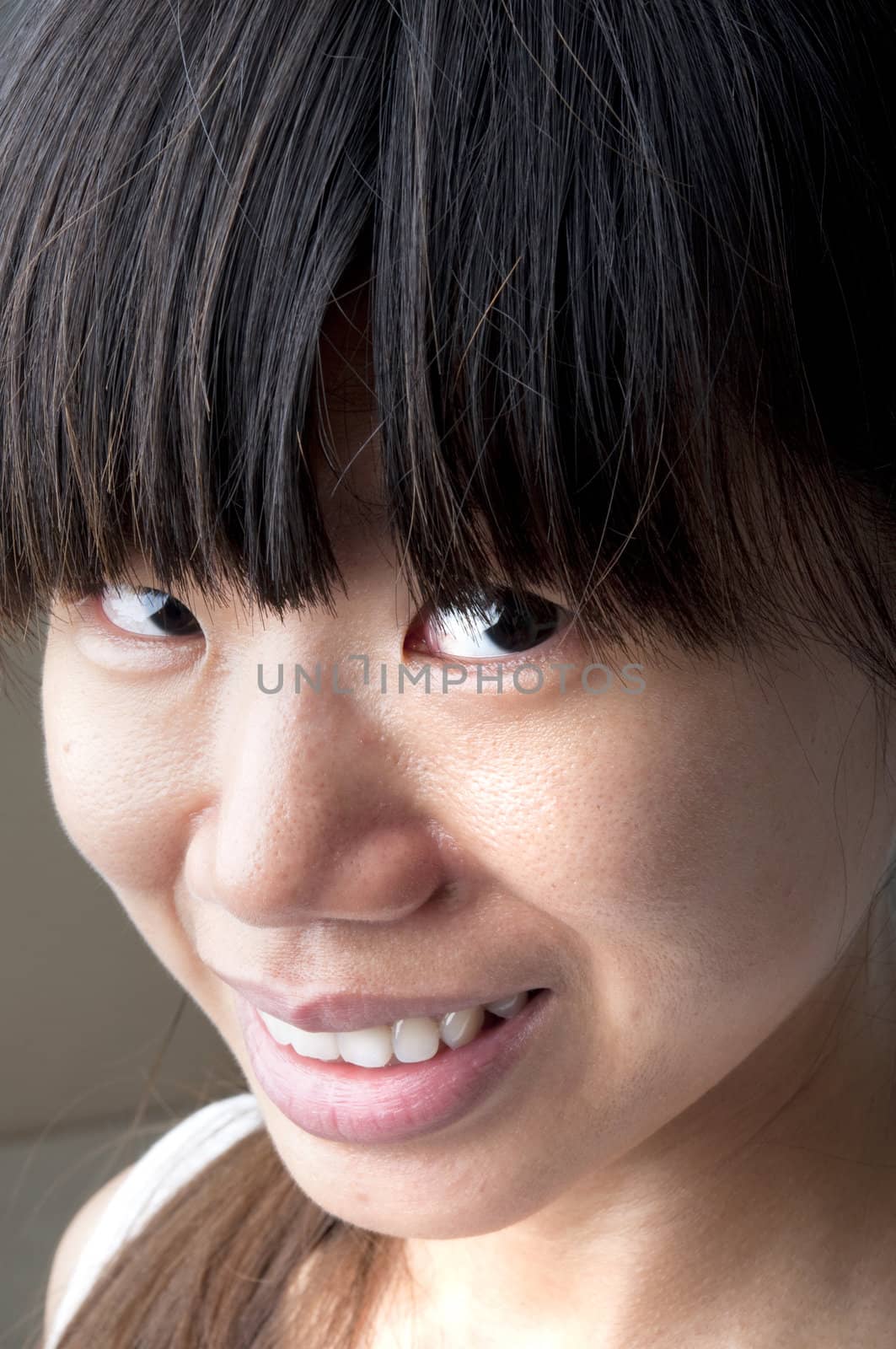 close up of a smiling asian girl 