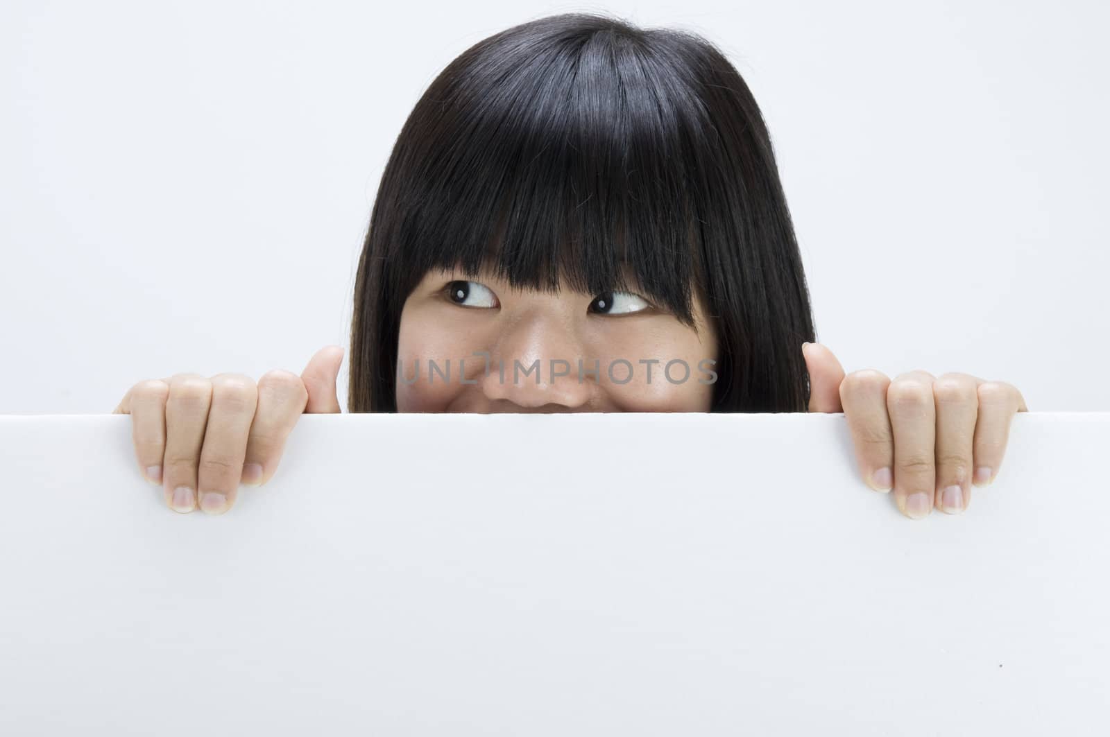 asian girl hiding with a blank card board by yuliang11