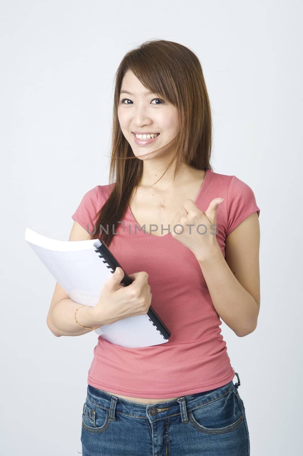 asian college girl holding a book