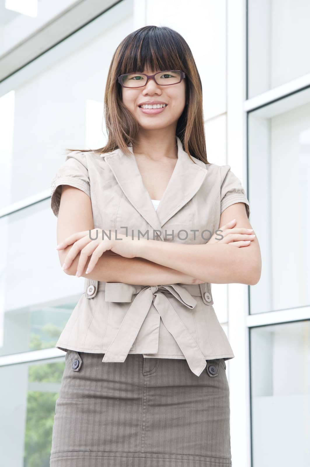 asian business women folding hands with office background 