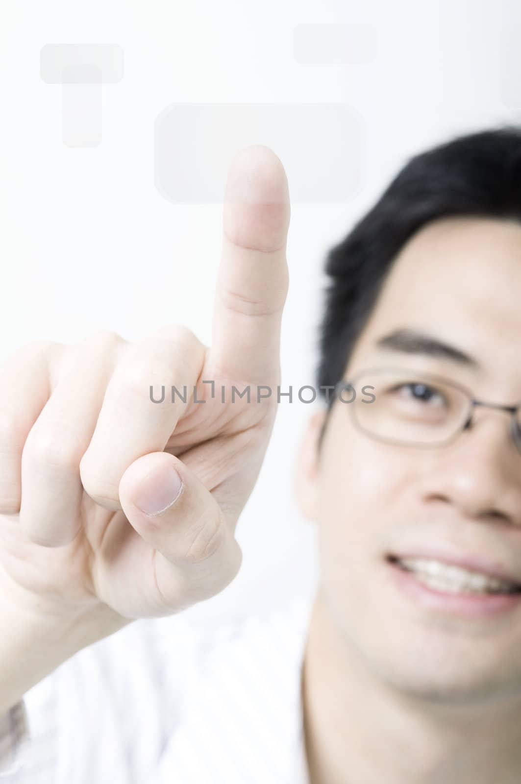 Asian business man pressing a touchscreen button  by yuliang11
