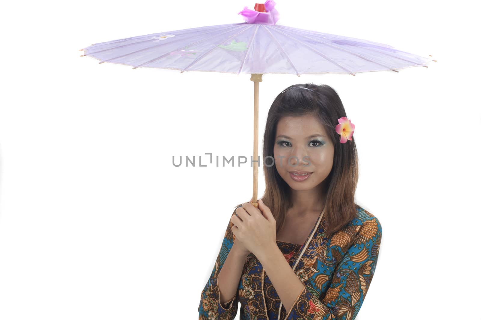 malay girl with hand holding umbrella with kebaya dress