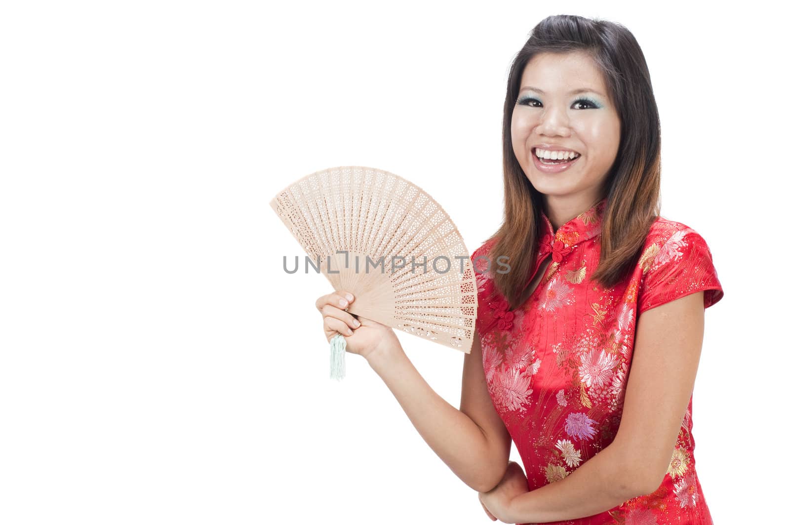 chinese new year girl  smiling and holding a fan with isolated white background 