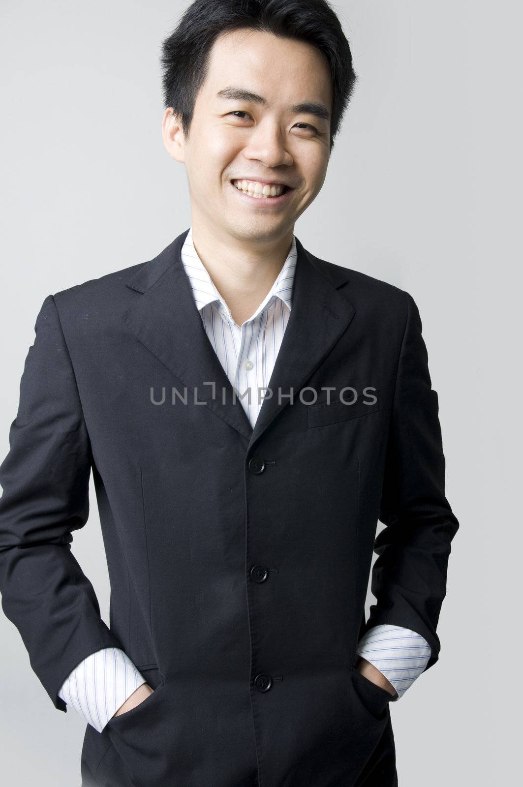 portrait of a happy smiling young asian businessman