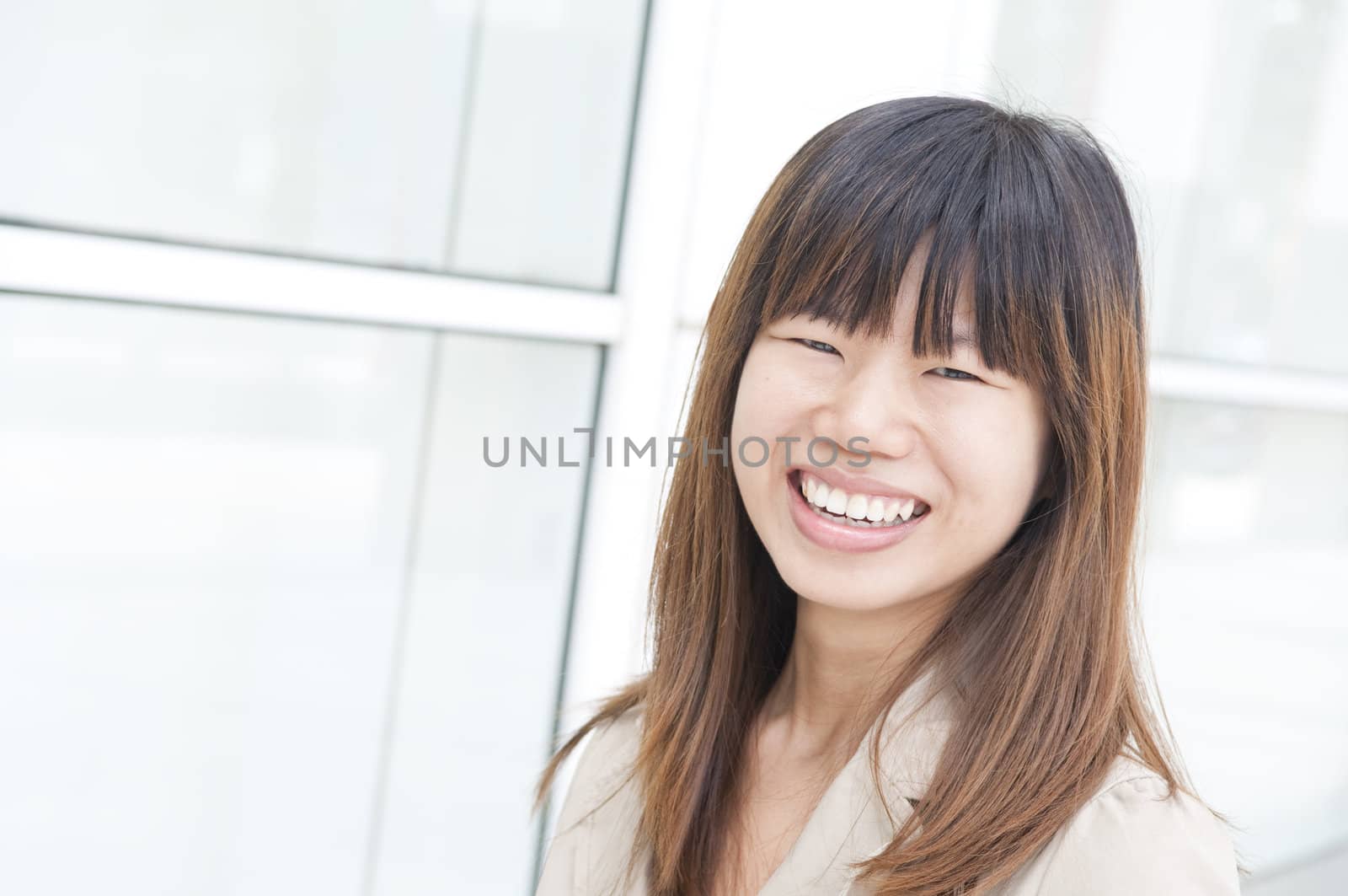 asian business women smiling with office background