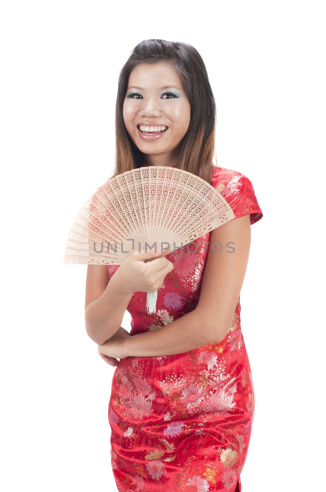happy chinese girl with fan duing chinese new year 