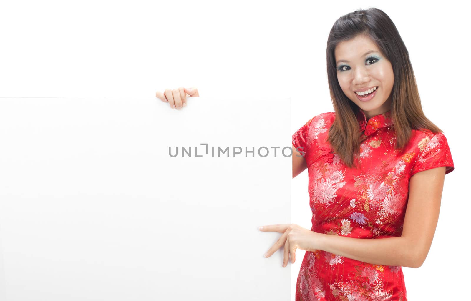 chinese girl smiling in a cheongsam with blank white cardboard