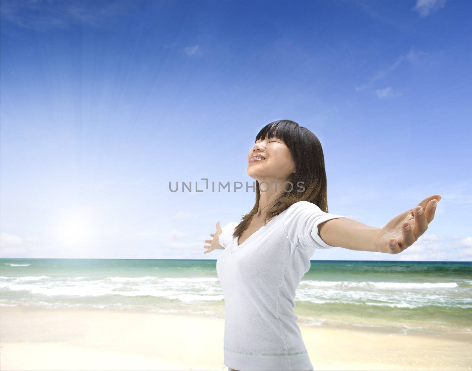 asian girl freedom relaxation concept photo on a beach