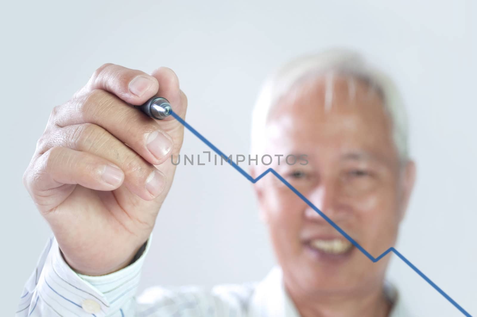 senior asian business man drawing upward trend graph 