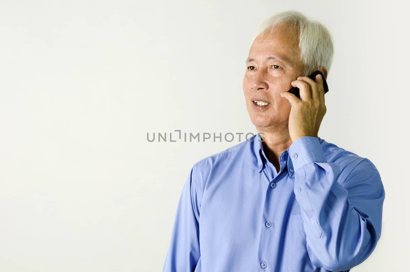senior asian business man on phone