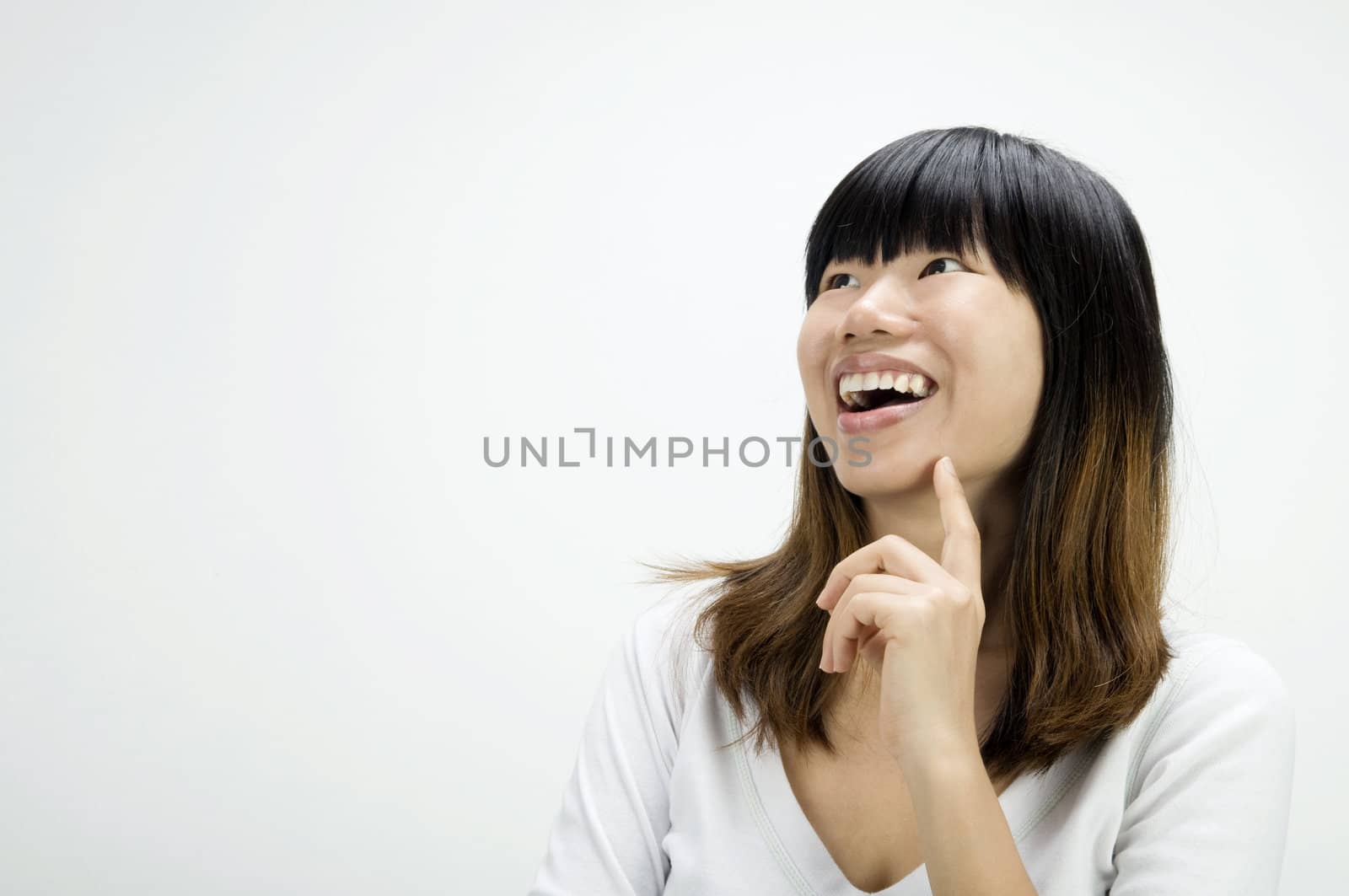 portrait shot of asian girl having a thought