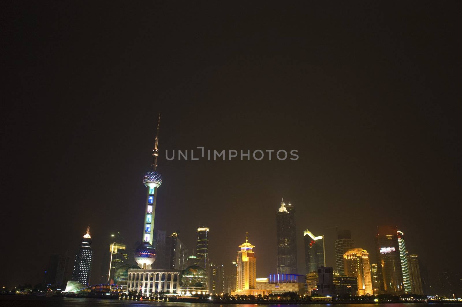 urban night view of shanghai city from pudong with a lot of empty spaces for advertising purpose